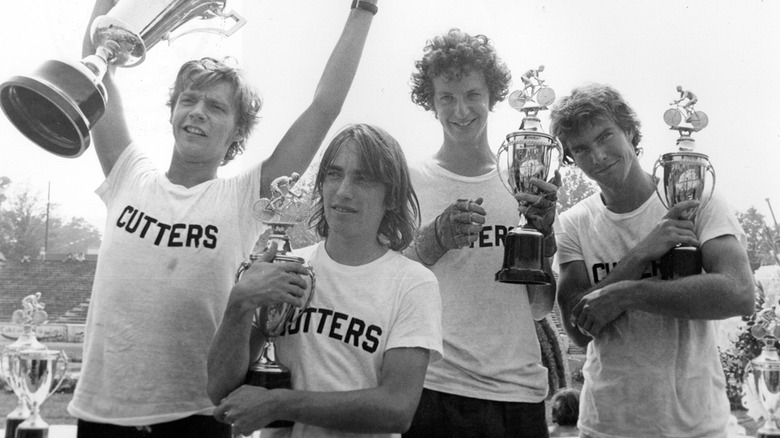 The Cutters team in Breaking Away pose with trophies