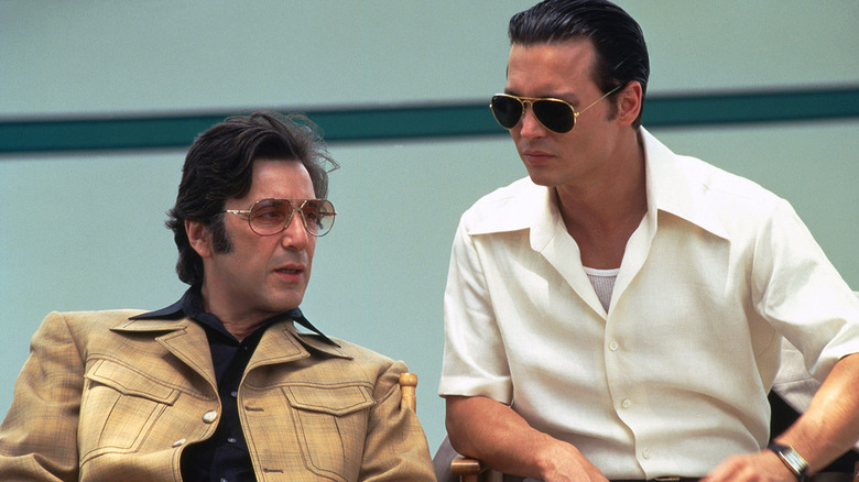 al pacino and johnny depp sitting donnie brasco