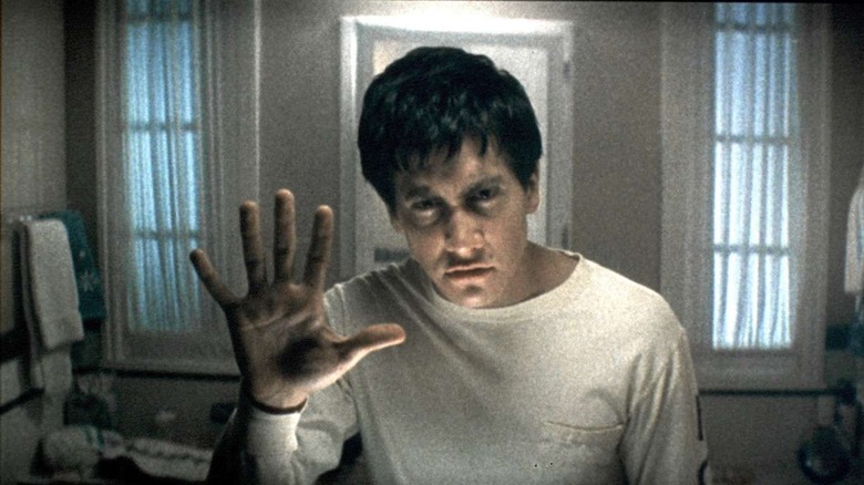 Donnie Darko Jake Gyllenhaal holding up hand