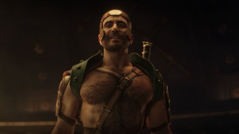 Lightly armored over a hairy bare chest, Hercules bares his teeth