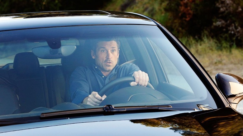 Derek driving car looking shocked Grey's Anatomy