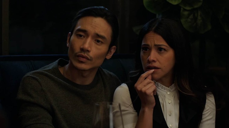 Manny Jacinto as Logan with Gina Rodriguez as Anne dining at a restaurant