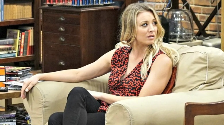 Penny in armchair looking over shoulder Big Bang Theory