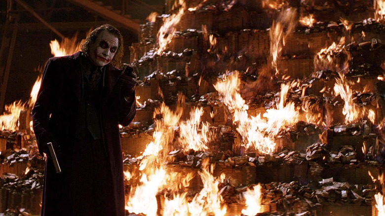 The Joker burning money