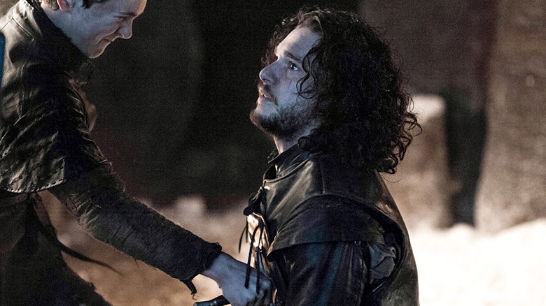 Kit Harrington kneeling stabbed Game of Thrones