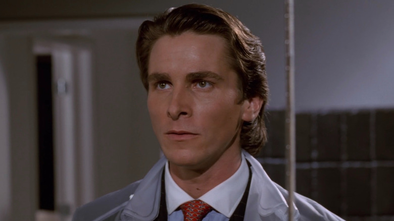 Patrick unshaven staring ahead American Psycho