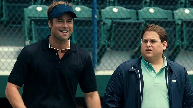 Brad Pitt grins while Jonah Hill looks concerned in Moneyball