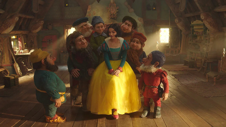 Snow White surrounded by dwarves