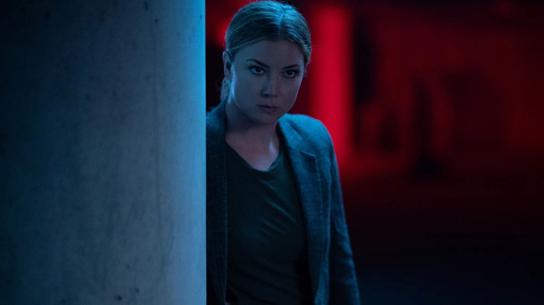 Sharon Carter peers from behind a cargo container in The Falcon and the Winter Soldier