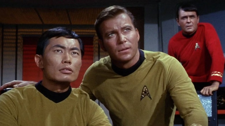 Star Trek Kirk puts his hand on Sulu's shoulder