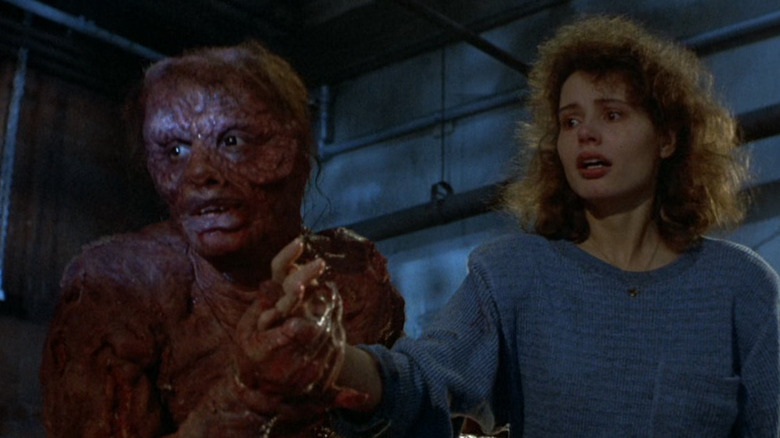 The Fly Geena Davis holding hands mutated Jeff Goldblum